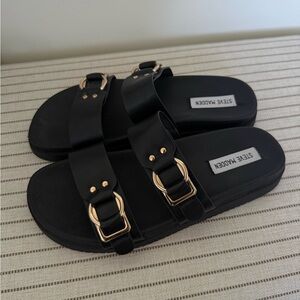 Steve Madden black sandals with gold buckle